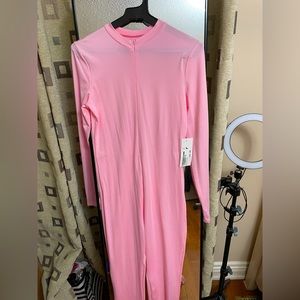 Zip up pink jumpsuit with tag still on!